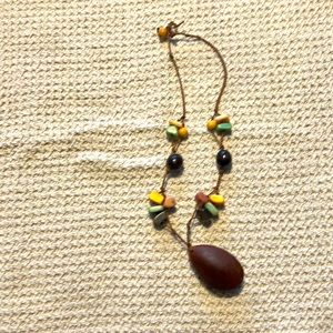 This neckless is originally from Brazil made out of real coconut.